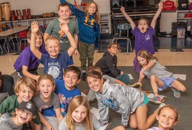 A classroom of students acting silly