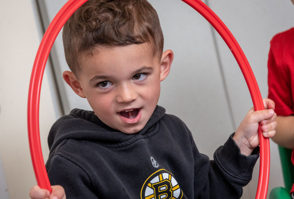 Preschool student with a hoop - Fall 2022