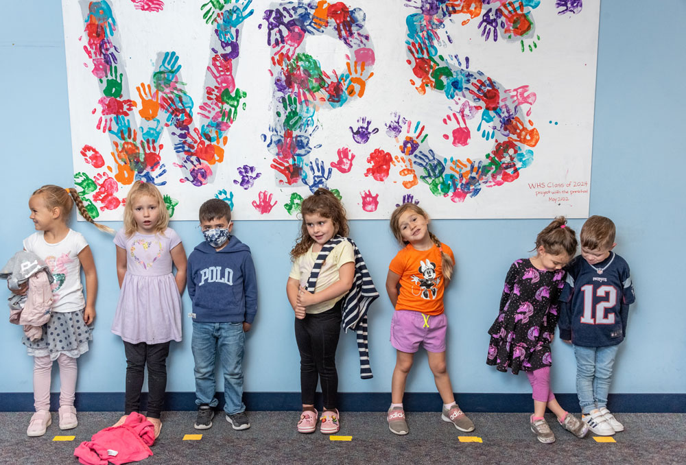 Preschool students under a sign - Fall 2022