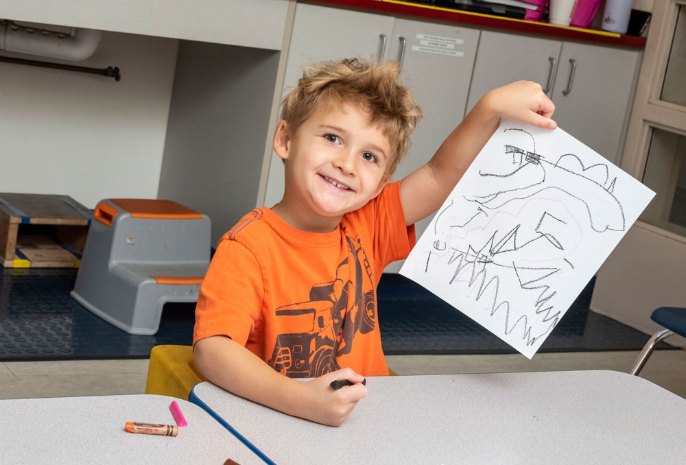 PreSchool boy holding paper - Spring 2023