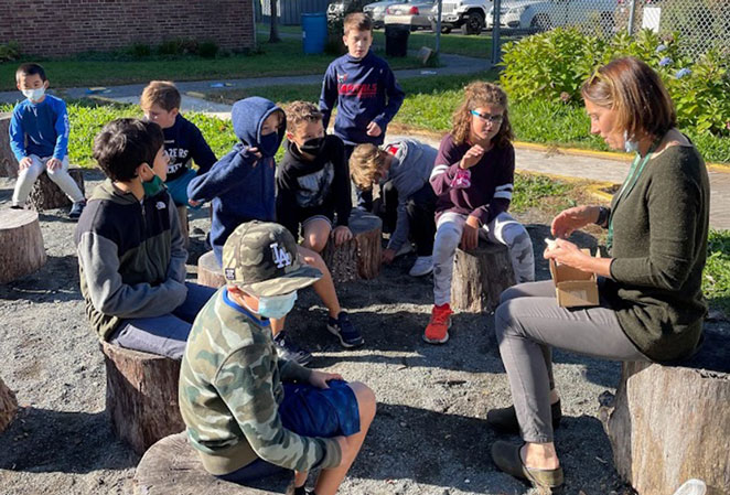 Student listening and learning in the outdoor classroom