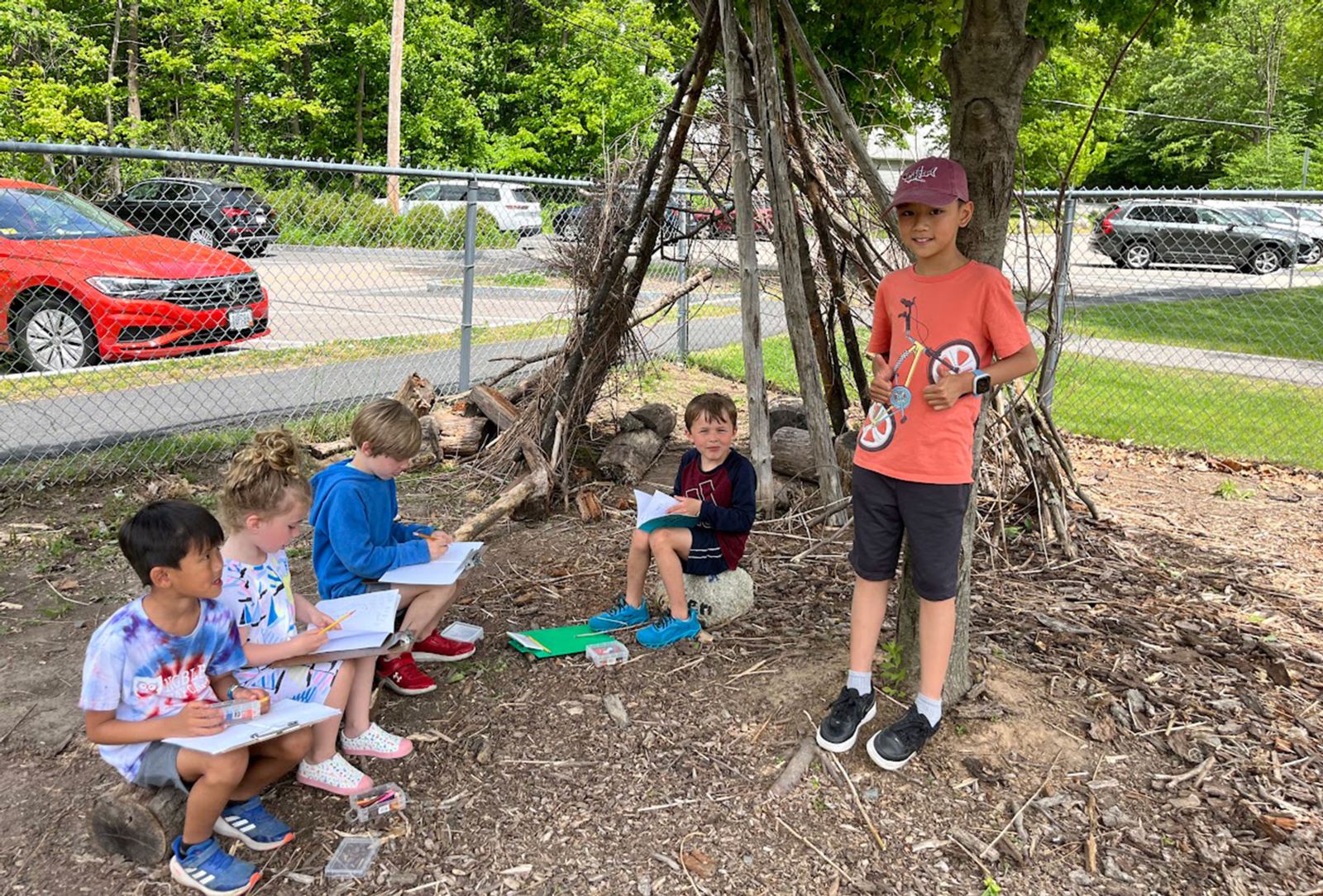 Kids sitting in the Outdoor Classroom